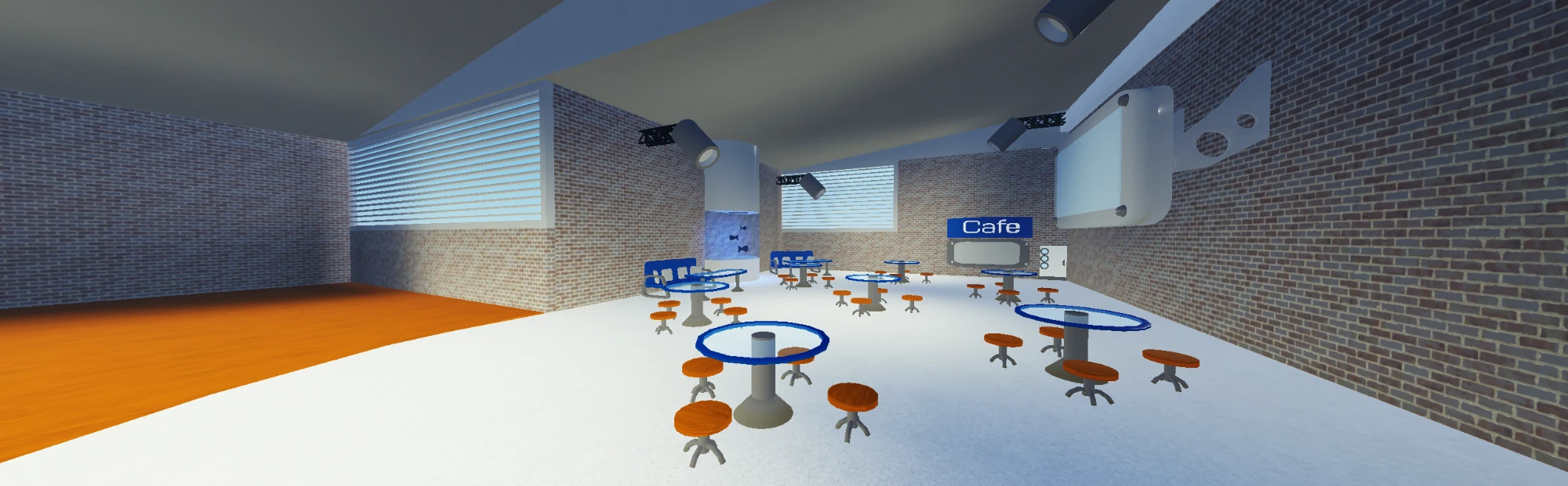 The café: round glass-topped tables with orange stools, a blue Café sign, brick walls and overhead spotlights.