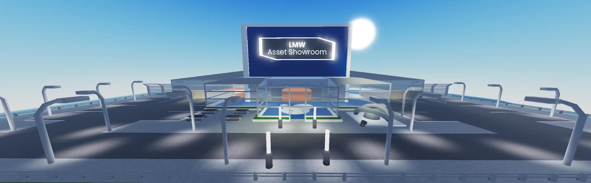 The LMW Asset Showroom: a blue-and-silver building with a large glowing sign, a glass-walled entrance and a car park, on a platform above open water.